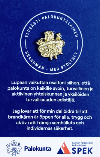 Kultainen Ylpeästi palokuntalainen -pinssi.